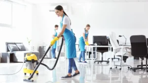 A cleaner vacuuming floor ft. commercial cleaning services in Kathmandu